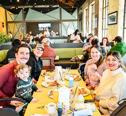A family enjoying breakfast at a Hatch location A family enjoying breakfast at a Hatch location