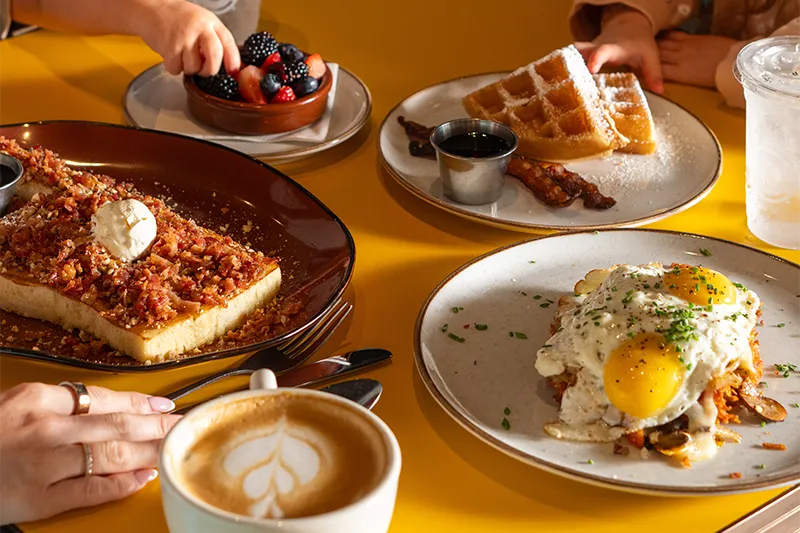 Breakfast plates and coffee at Hatch Early Mood Food
