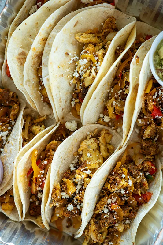 Breakfast tacos prepared in a catering tin